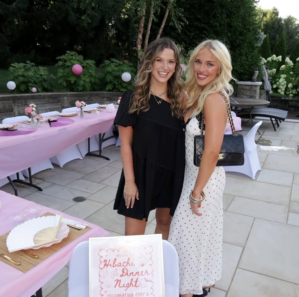 Guests at a pink-themed hibachi dinner